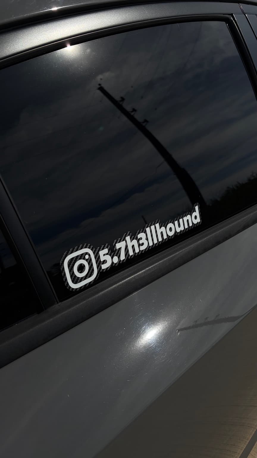 Custom 5.7h3llhound window sticker installed on a car's rear side window